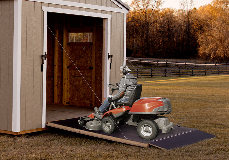 riding-lawn-mower-going-up-rampage-door-md-2
